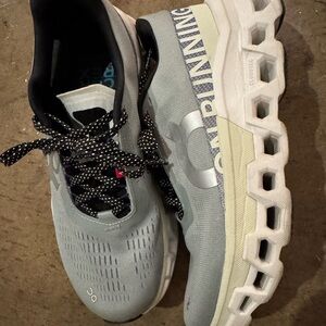 On Running Light Gray and White Sneakers